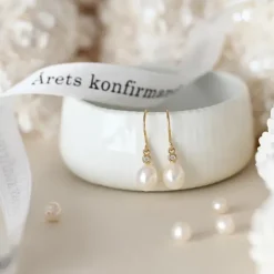 Ovale 7 - 8 mm aaa-graded ferskvandsperle brillantøreringe i 14 karat guld med diamanter