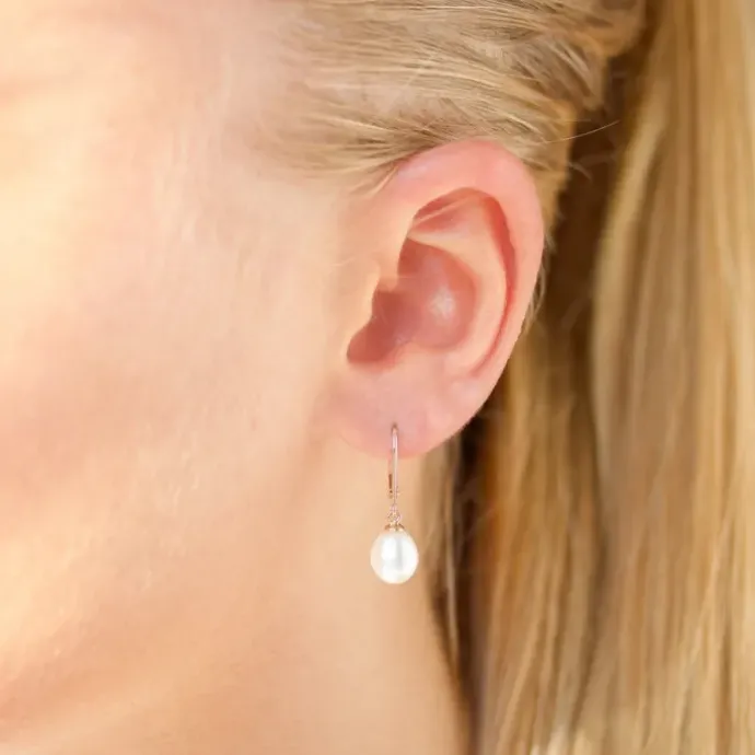 Ovale 7 - 8 mm aaa-graded ferskvandsperle øreringe i 14 karat guld med