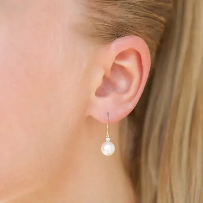 Runde 7 - 8 mm aaa-graded ferskvandsperle diamantøreringe i 14 karat guld med diamanter